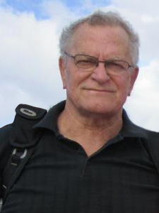 Here's an alt tag for the image: > Headshot of an older man with glasses.