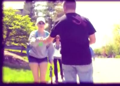 Man and woman walking on campus.