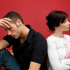 A man and woman sitting next to each other.
