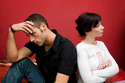 A man and woman sitting next to each other.